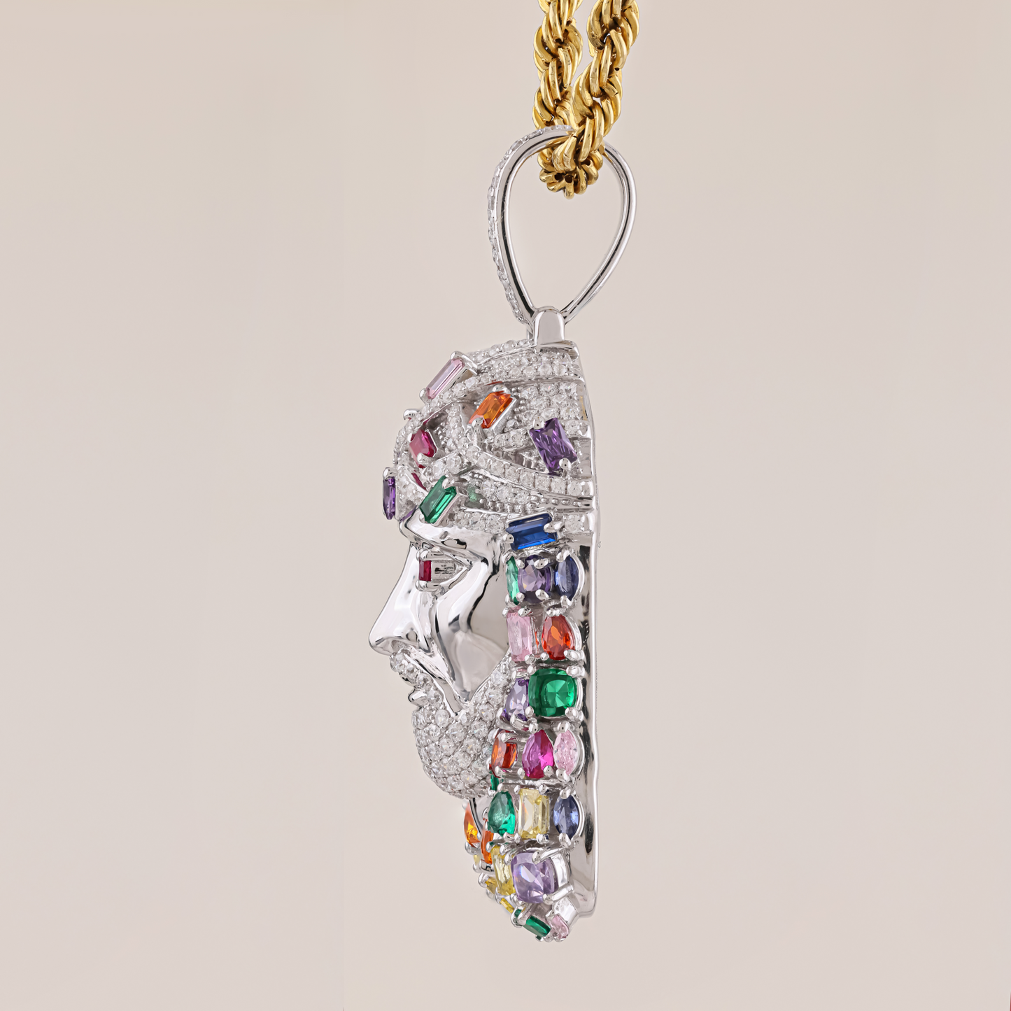 Jewelry pendant with multicolored gemstones on a beige background