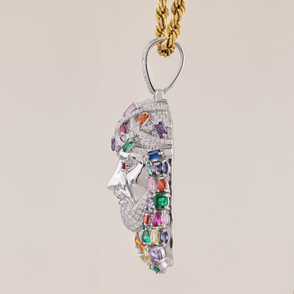 Jewelry pendant with multicolored gemstones on a beige background