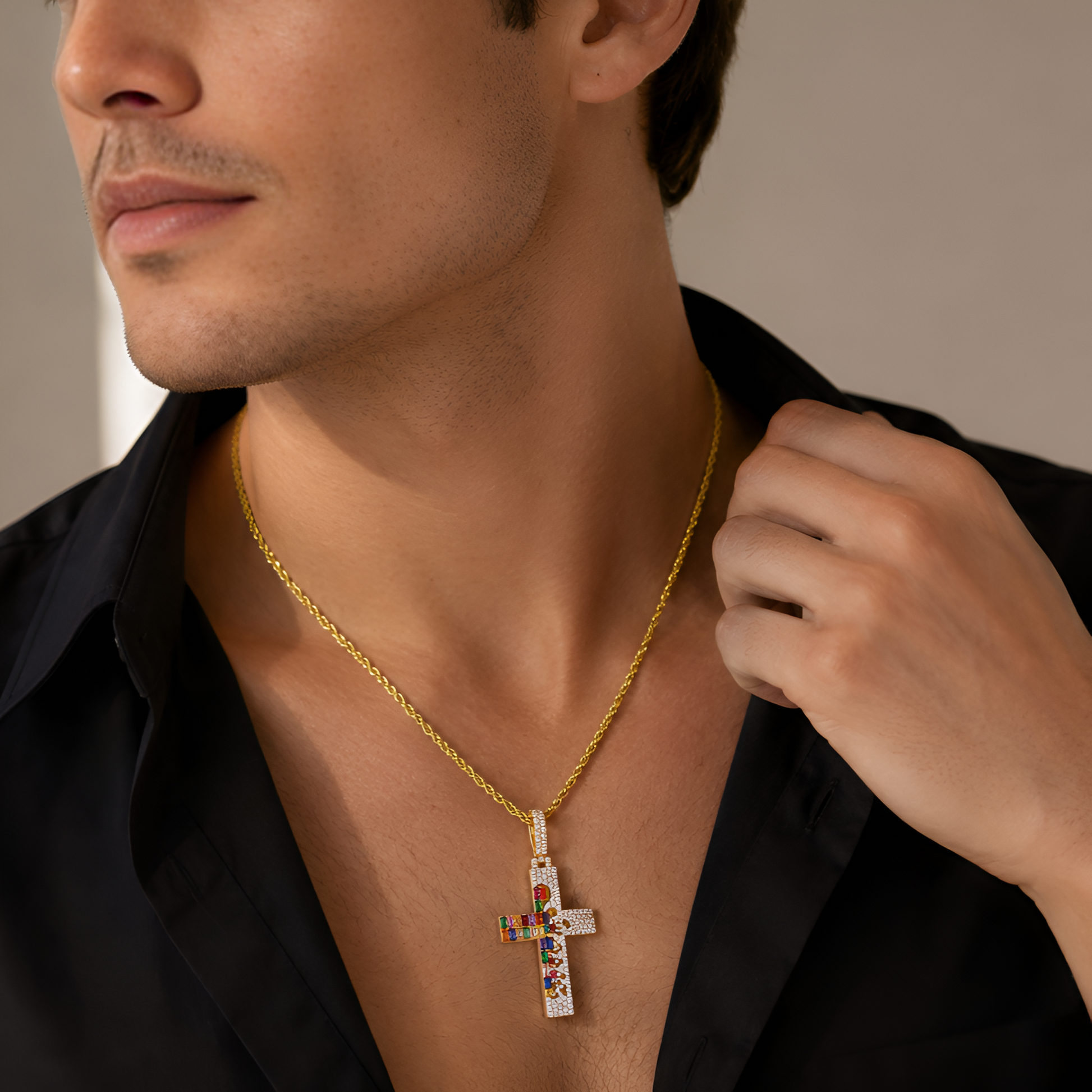 Woman wearing a gold necklace with a colorful hamsa pendant.