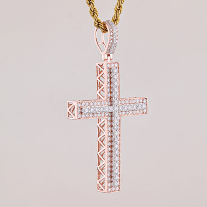 Rose gold cross pendant with diamonds on a light gray background