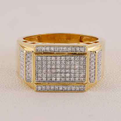Gold ring with diamond accents on a light gray background