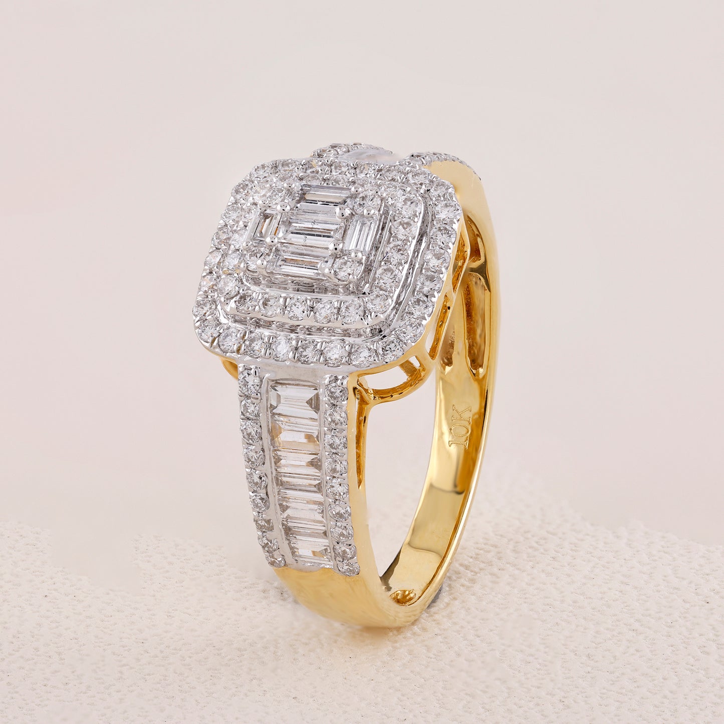 Gold ring with diamond accents on a light gray background