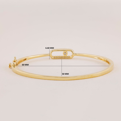 Gold bracelet with measurement details on a light gray background