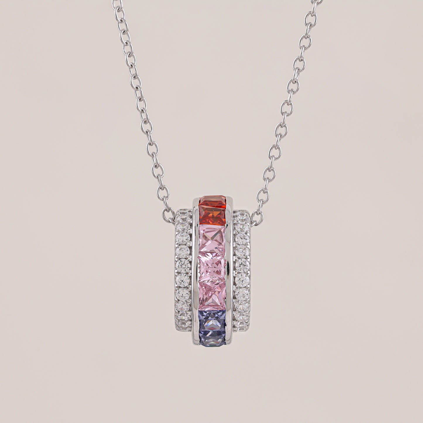 Necklace with colorful gemstones on a beige background