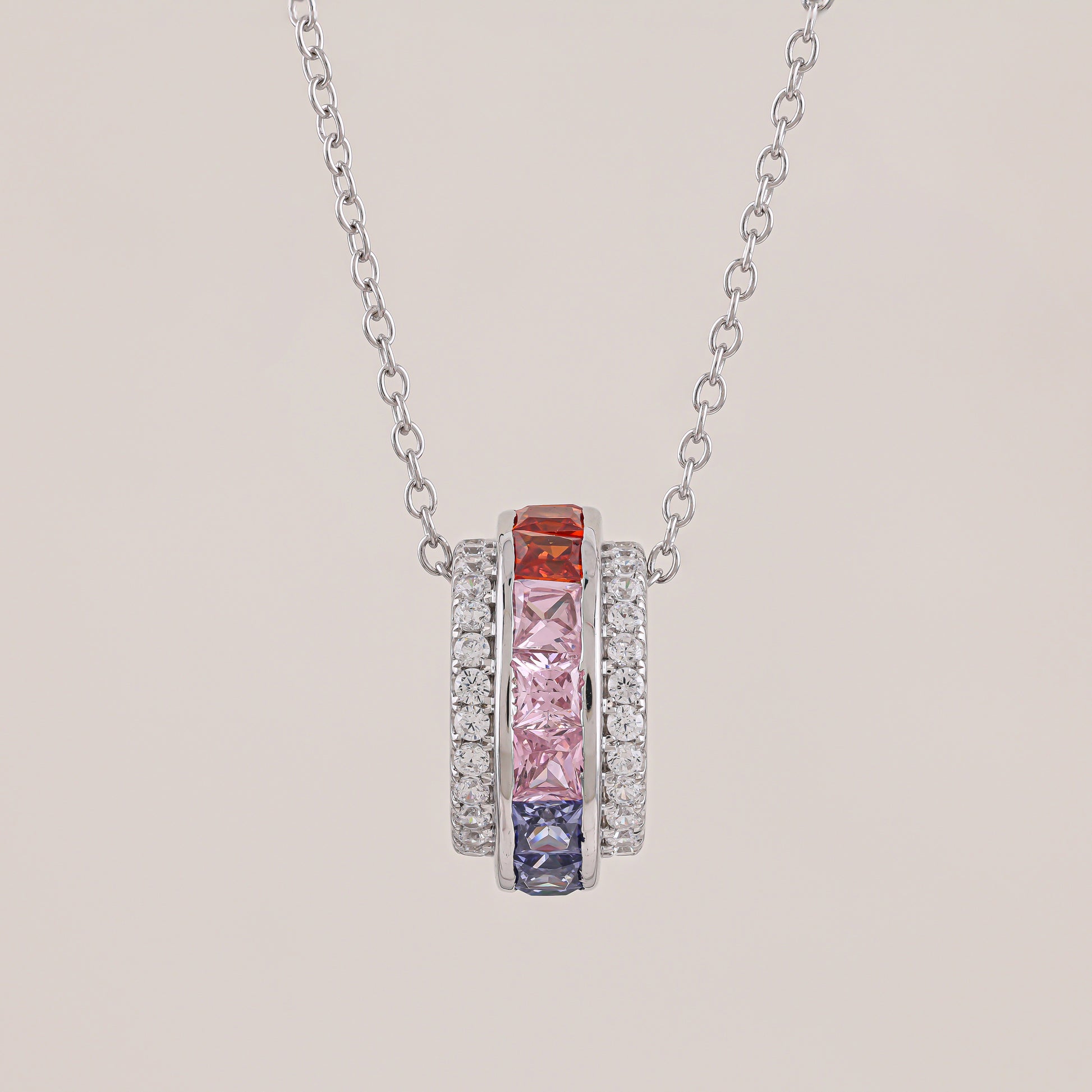 Necklace with colorful gemstones on a beige background