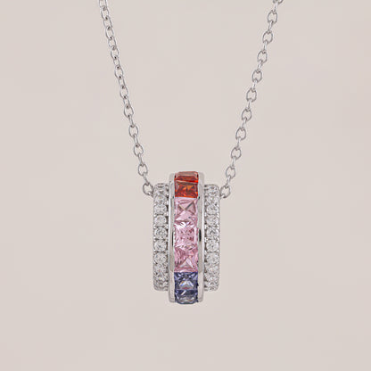 Necklace with colorful gemstones on a beige background