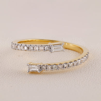 Gold bracelet with diamond accents on a light gray background