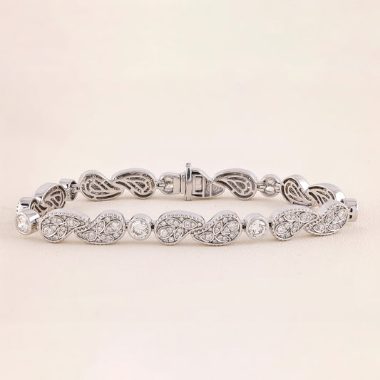 White Gold bracelet with intricate design on a light beige background