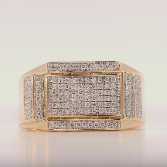 Gold ring with diamond accents on a light gray background Video