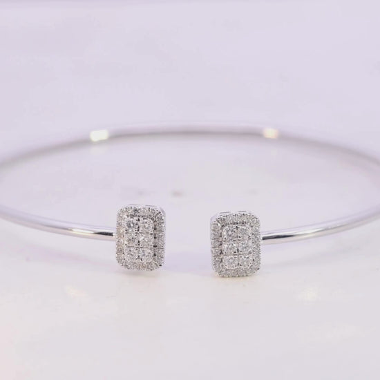 Gold bracelet with a smaall diamond on a beige background Video
