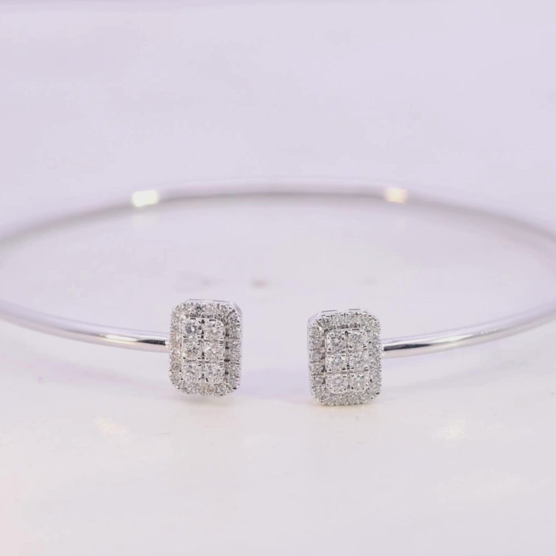 Gold bracelet with a smaall diamond on a beige background Video
