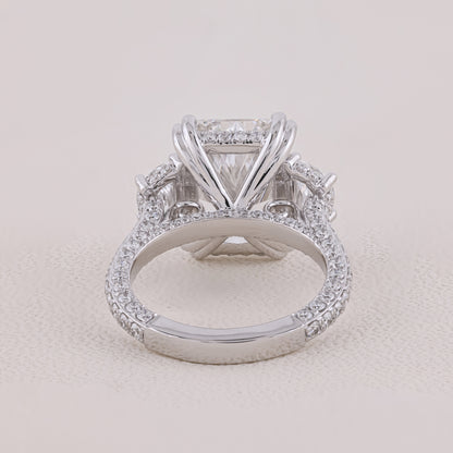 Diamond ring with a clear gemstone on a light beige background