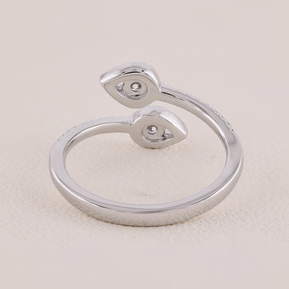 Silver ring with a unique design on a light beige background