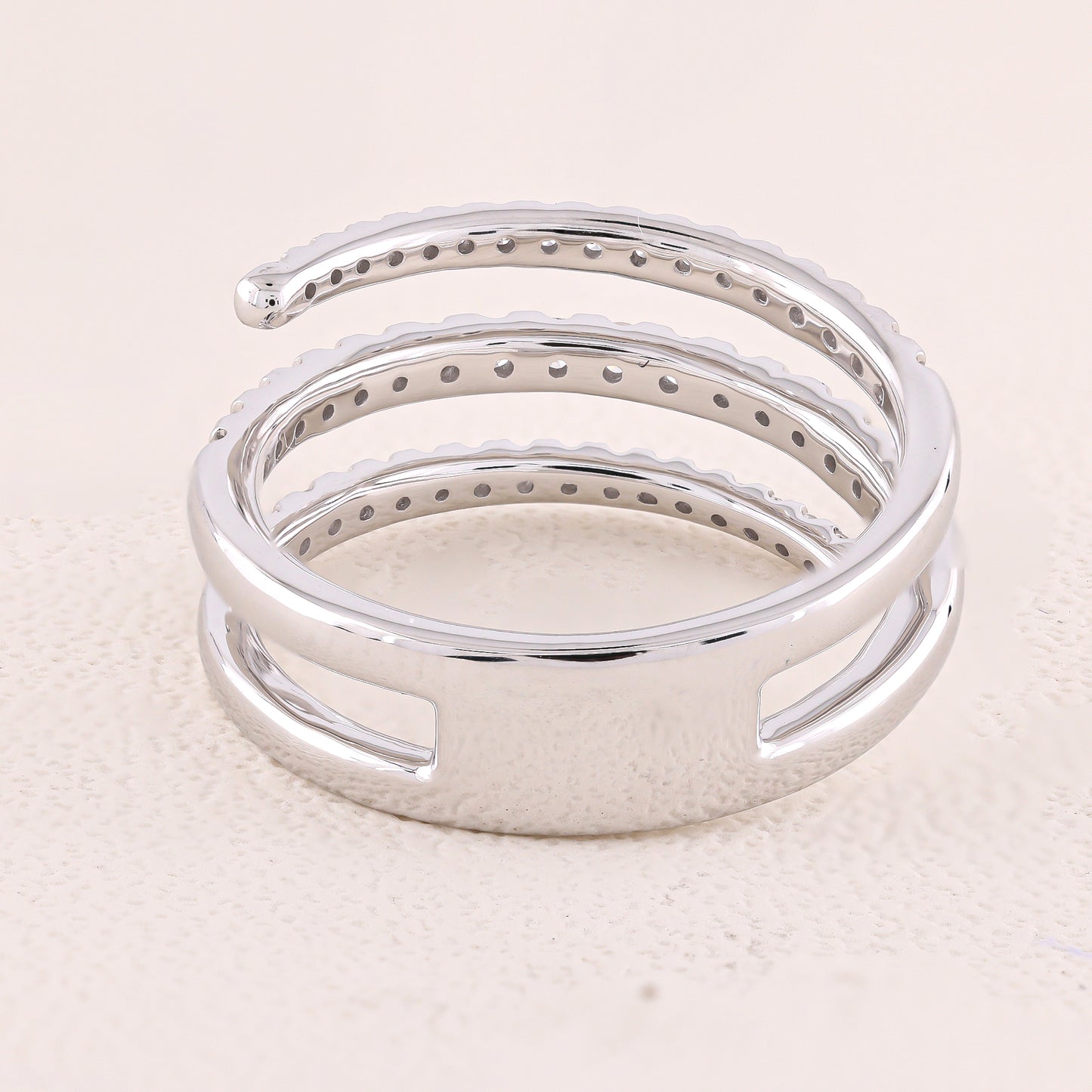 Silver bracelet on a light beige background