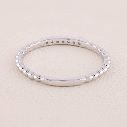 Silver bracelet on a beige background