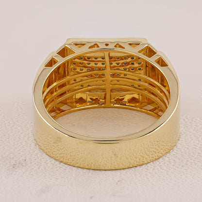 Gold ring with intricate design on a light gray background