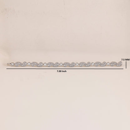 White Gold hair barrette with clear stones on a beige background, showing measurements.
