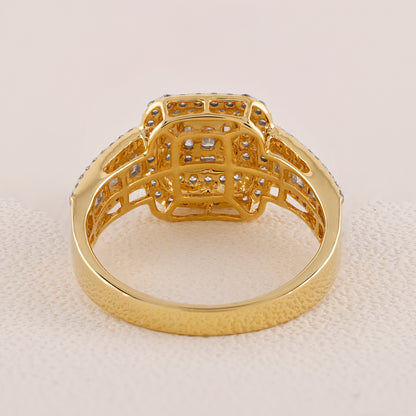 Gold ring with intricate design on a light beige background