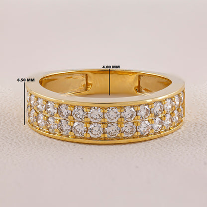 Gold ring with diamond accents on a light gray background