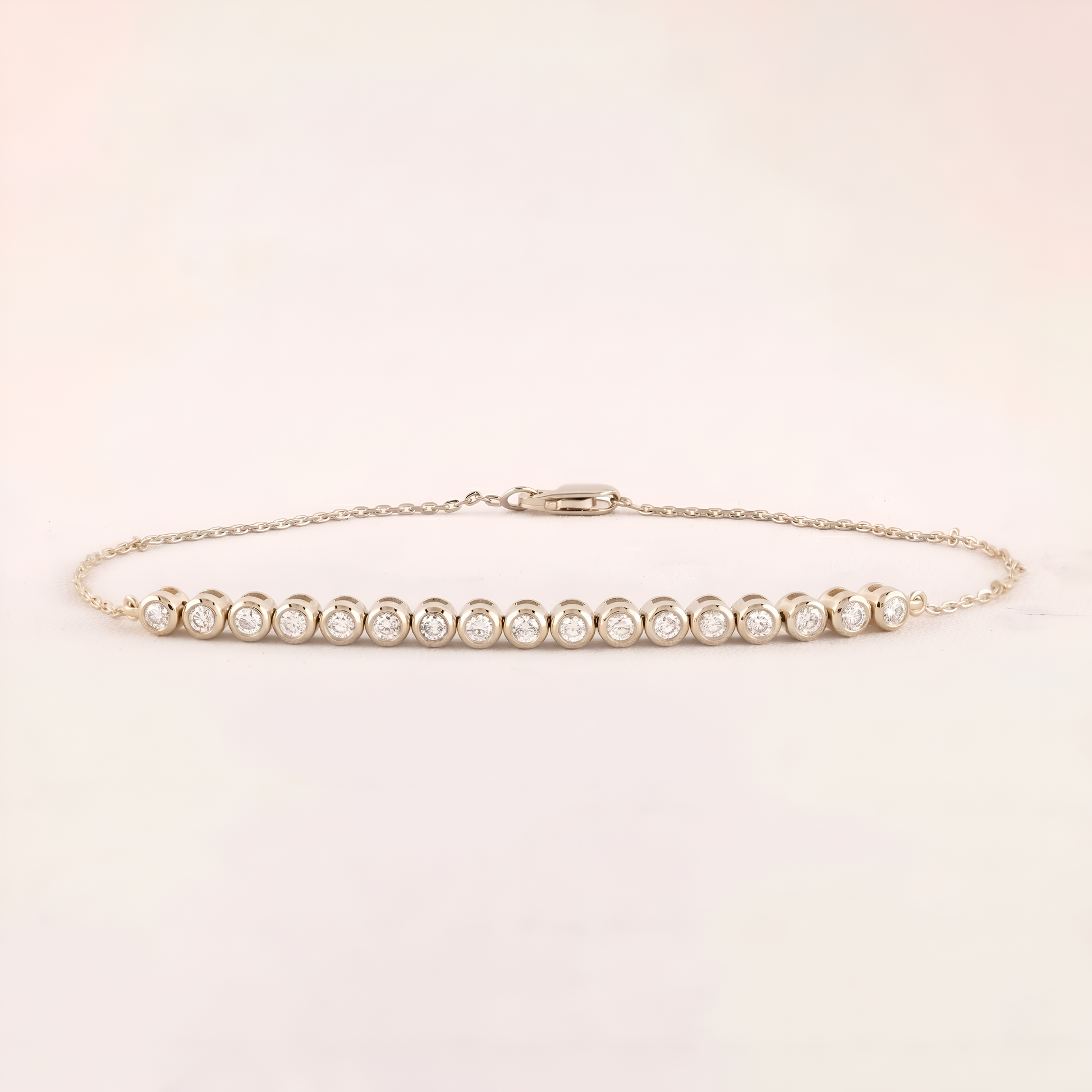 Gold bracelet with diamonds on a light beige background