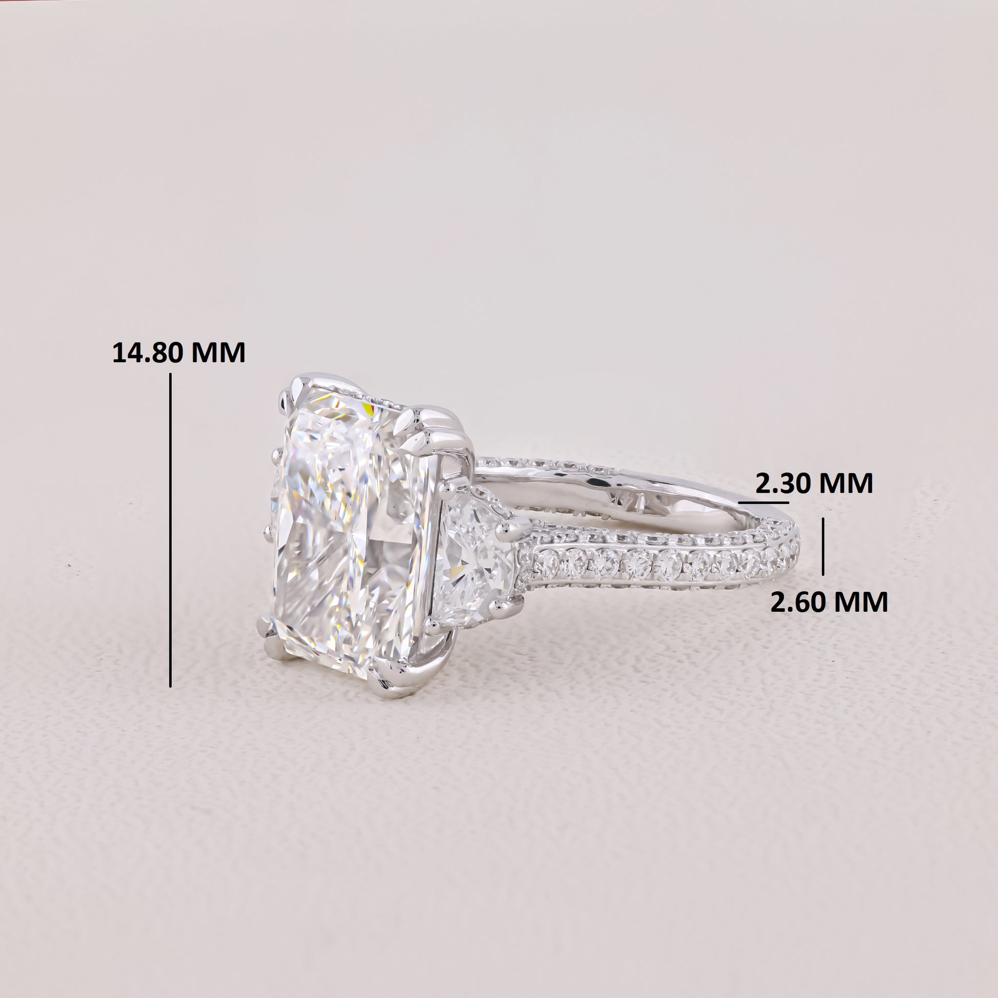 Diamond ring with measurements on a light gray background