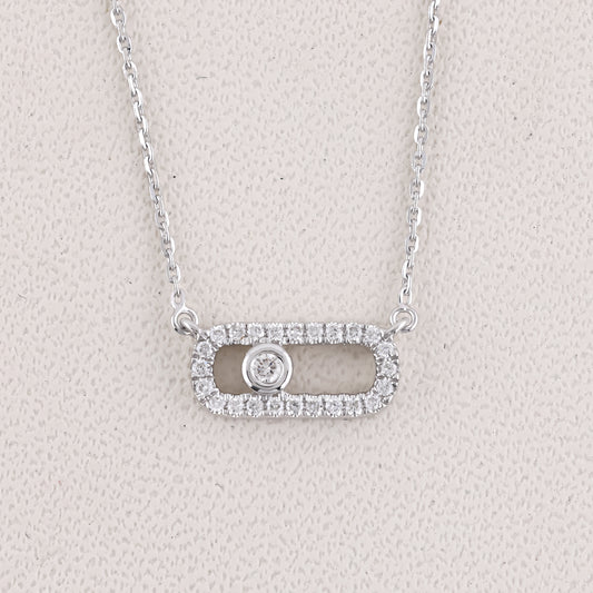 Silver necklace with a pendant on a light gray background
