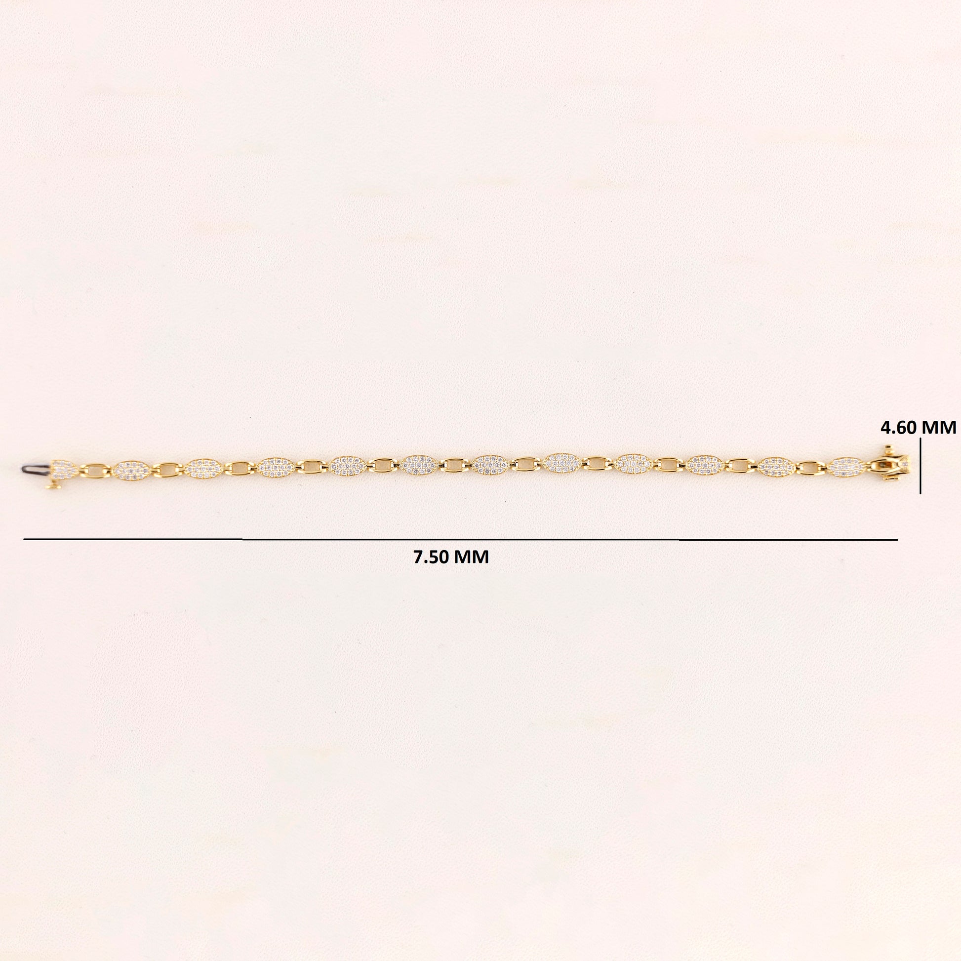 Gold chain bracelet with measurements on a white background